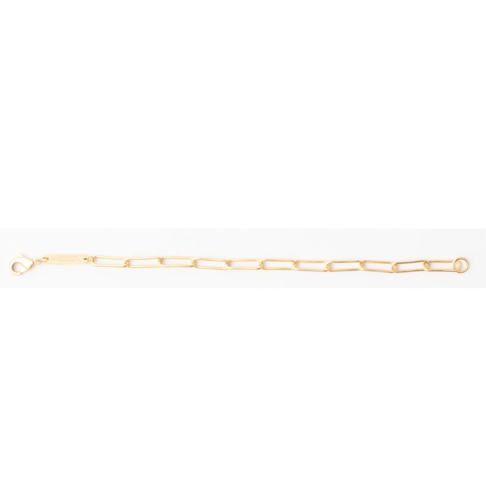 Delicate gold paperclip link chain bracelet with a lobster clasp closure on a plain white background.