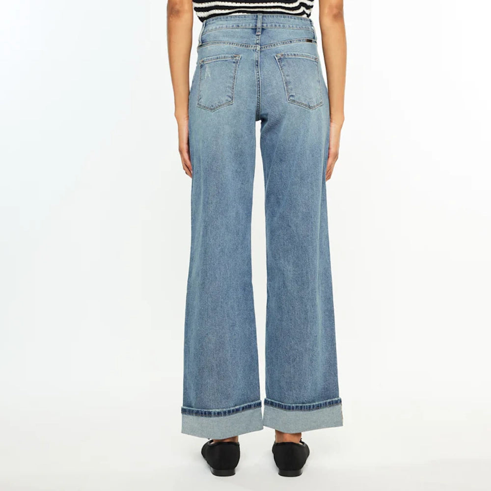 Rear view of Bellen Essentials high-rise wide-leg jeans in light wash denim featuring cuffed hems and back pockets.