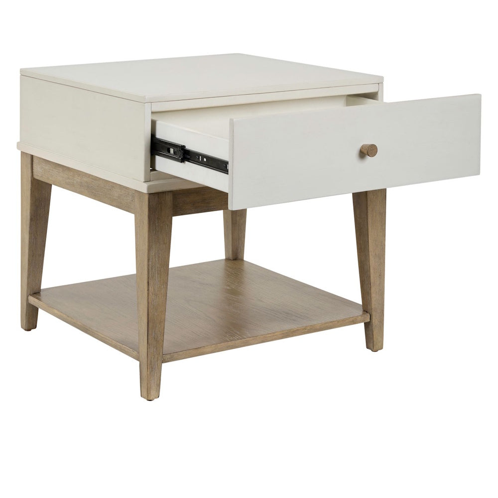 Two-tone square end table with open drawer and lower wood shelf.