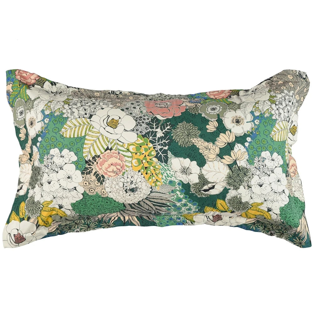 A rectangular green floral throw pillow with white, pink, and yellow flower patterns on a white background.
