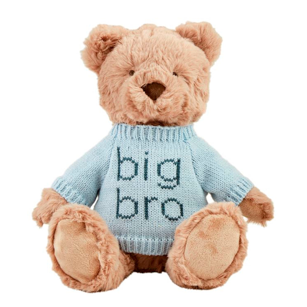 Plush tan teddy bear wearing a light blue knitted sweater with "big bro" embroidered in navy blue on a white background.