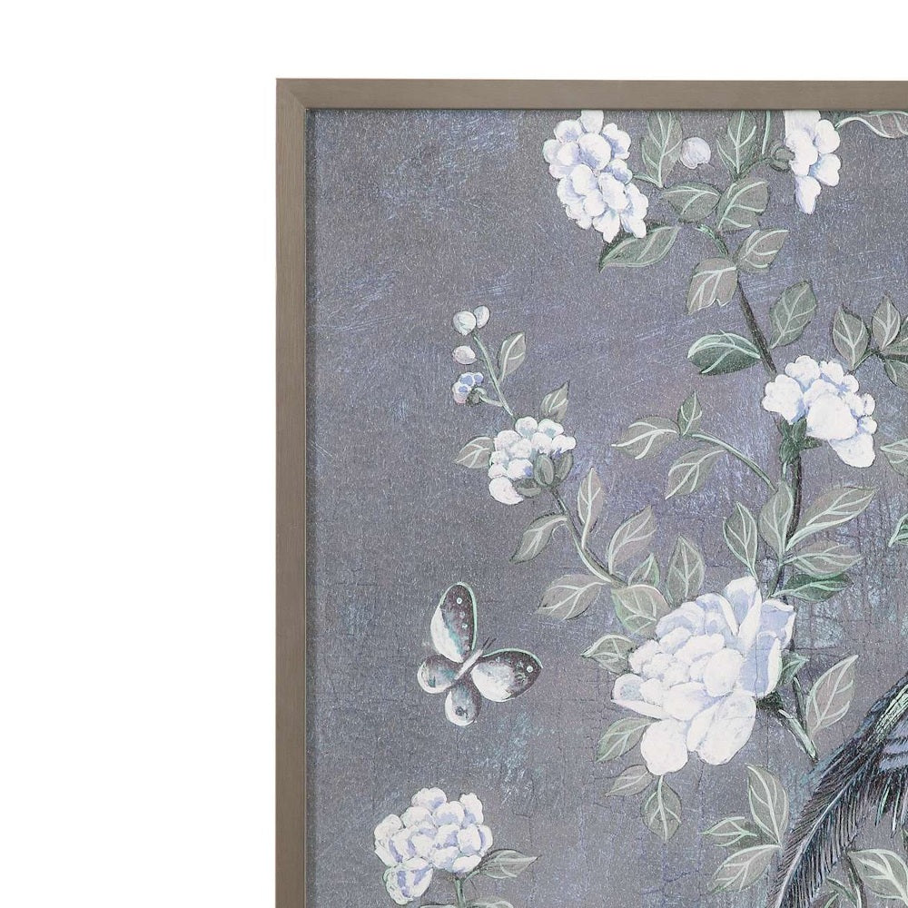 Close-up of a framed wall art print featuring white flowers and a butterfly on a textured blue and gray background.