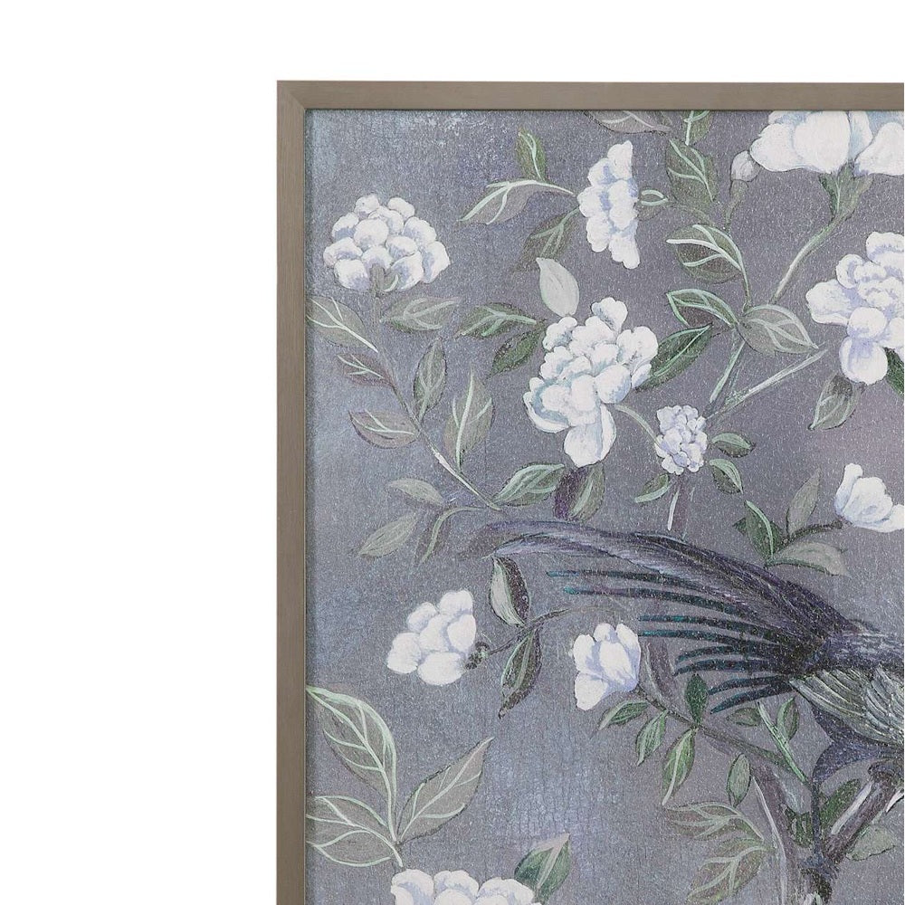 Framed floral wall art featuring white peonies and a bird with dark feathers on a textured slate gray background.
