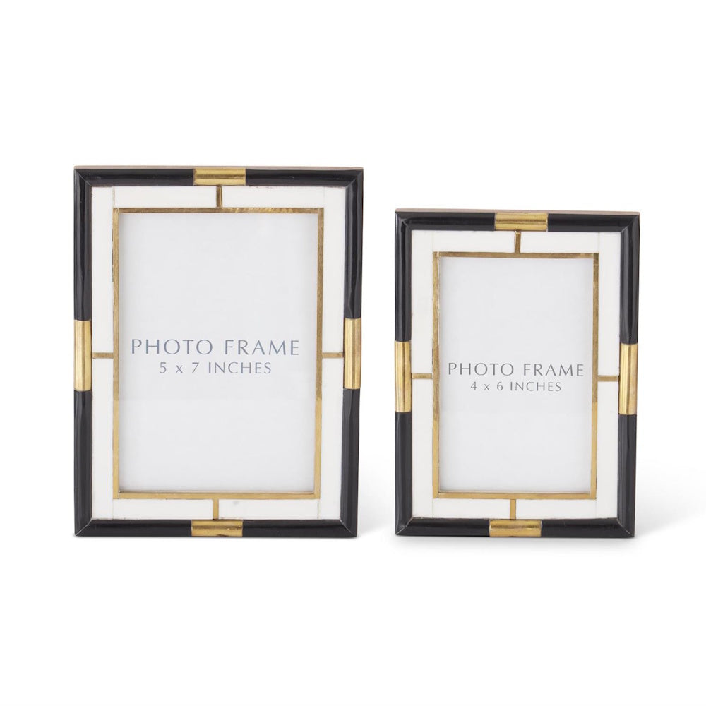 Set of two black, white, and gold inlaid photo frames in 5x7 and 4x6 sizes on a white background.