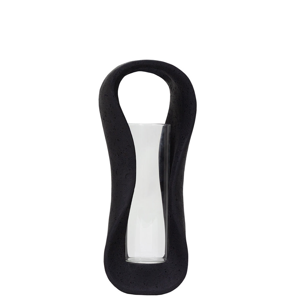 Modern black lava stone hurricane candle holder with a clear glass cylinder insert for minimalist home decor.
