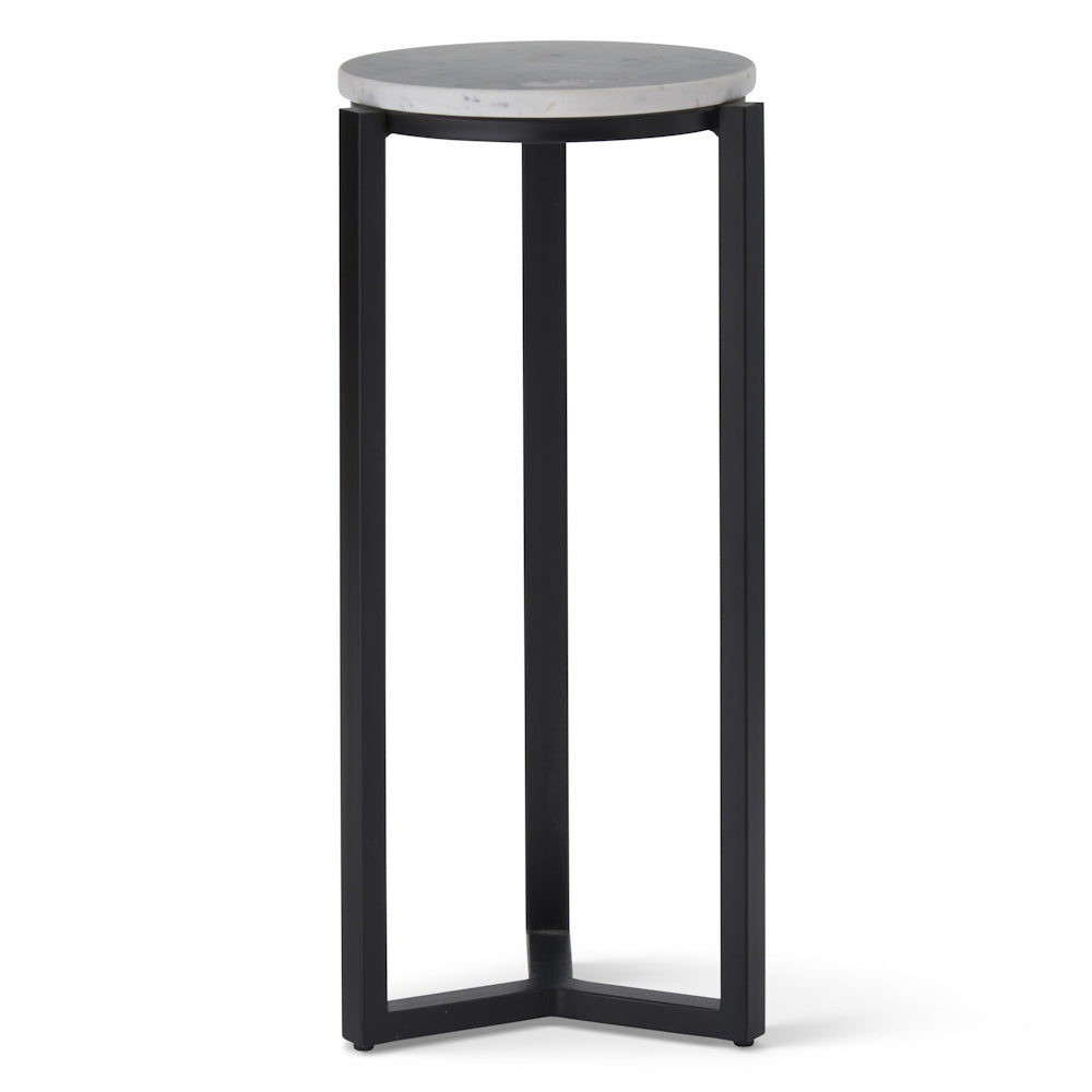 Round white marble drink table with a slim black metal tripod base, modern minimalist accent furniture for home decor.
