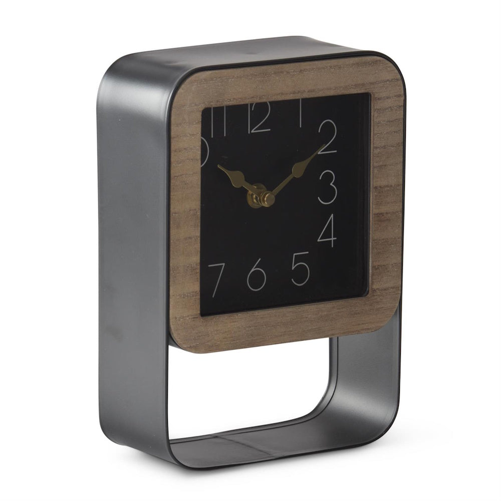 Angled side view of a square analog clock with wooden trim inside a dark metal open frame.