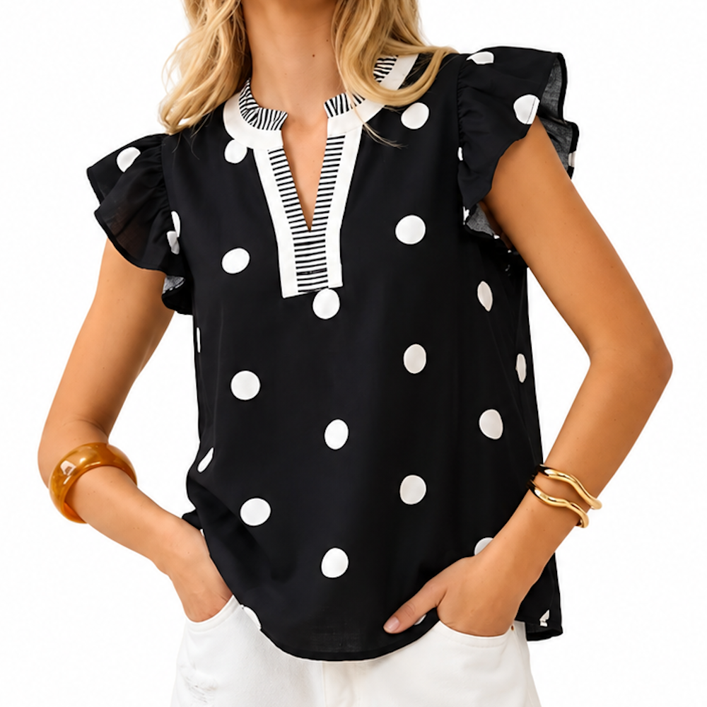 Front view of a black polka-dot cotton flutter-sleeve blouse with a split v-neck.