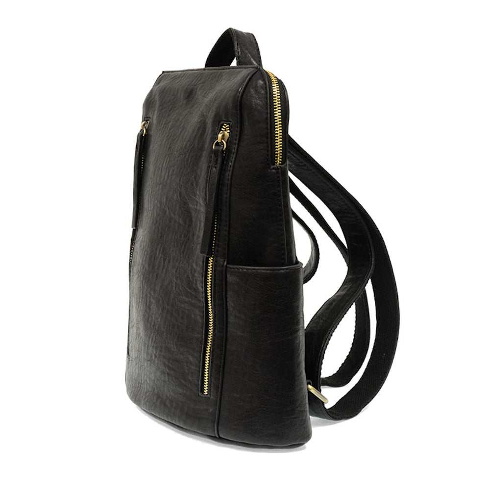 Black Raegan double zipper backpack in textured faux leather with gold hardware and side pocket on white background.