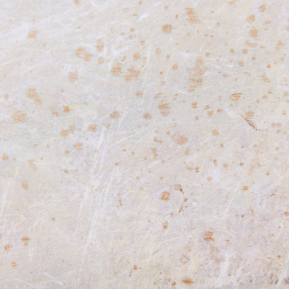 Close-up of textured neutral beige and white canvas with earthy speckles.