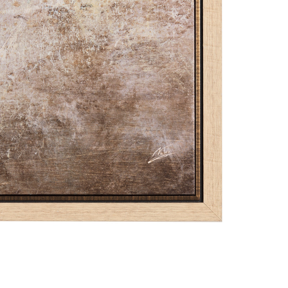 Close-up of the artist's signature on the lower corner of the framed abstract canvas.