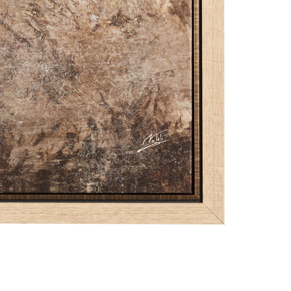 Close-up of the artist's signature on the lower right corner of a framed textured brown canvas.