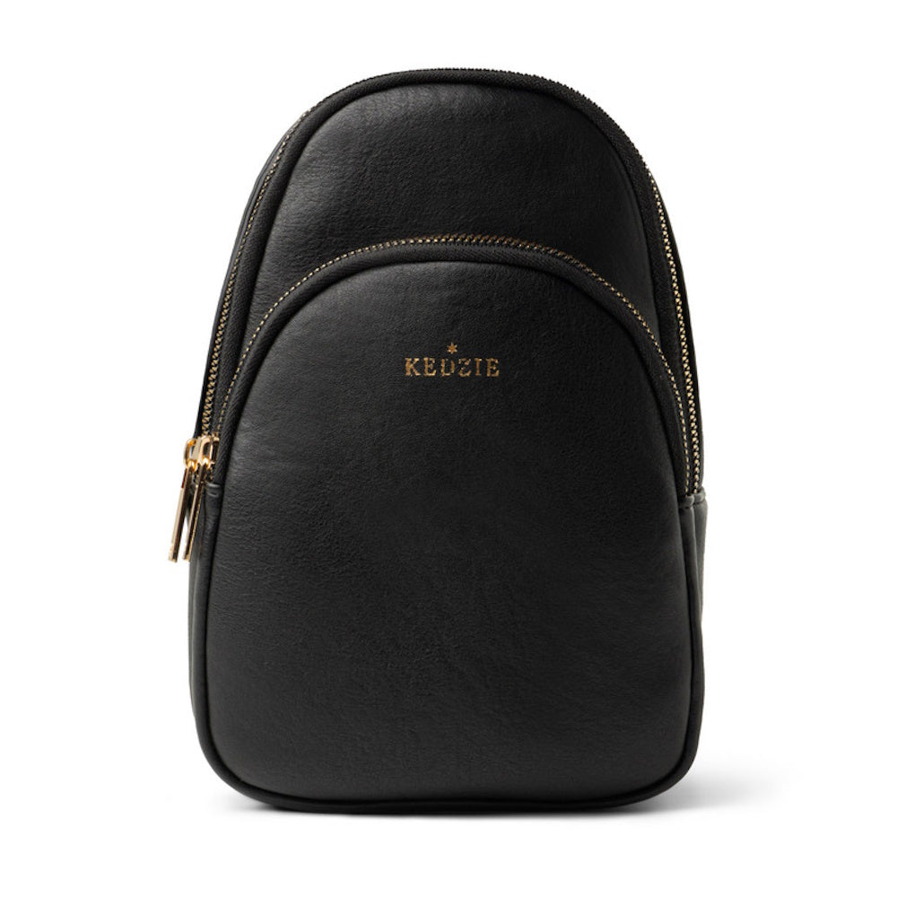 Black faux-leather Kedzie backpack with gold zippers on a white background.