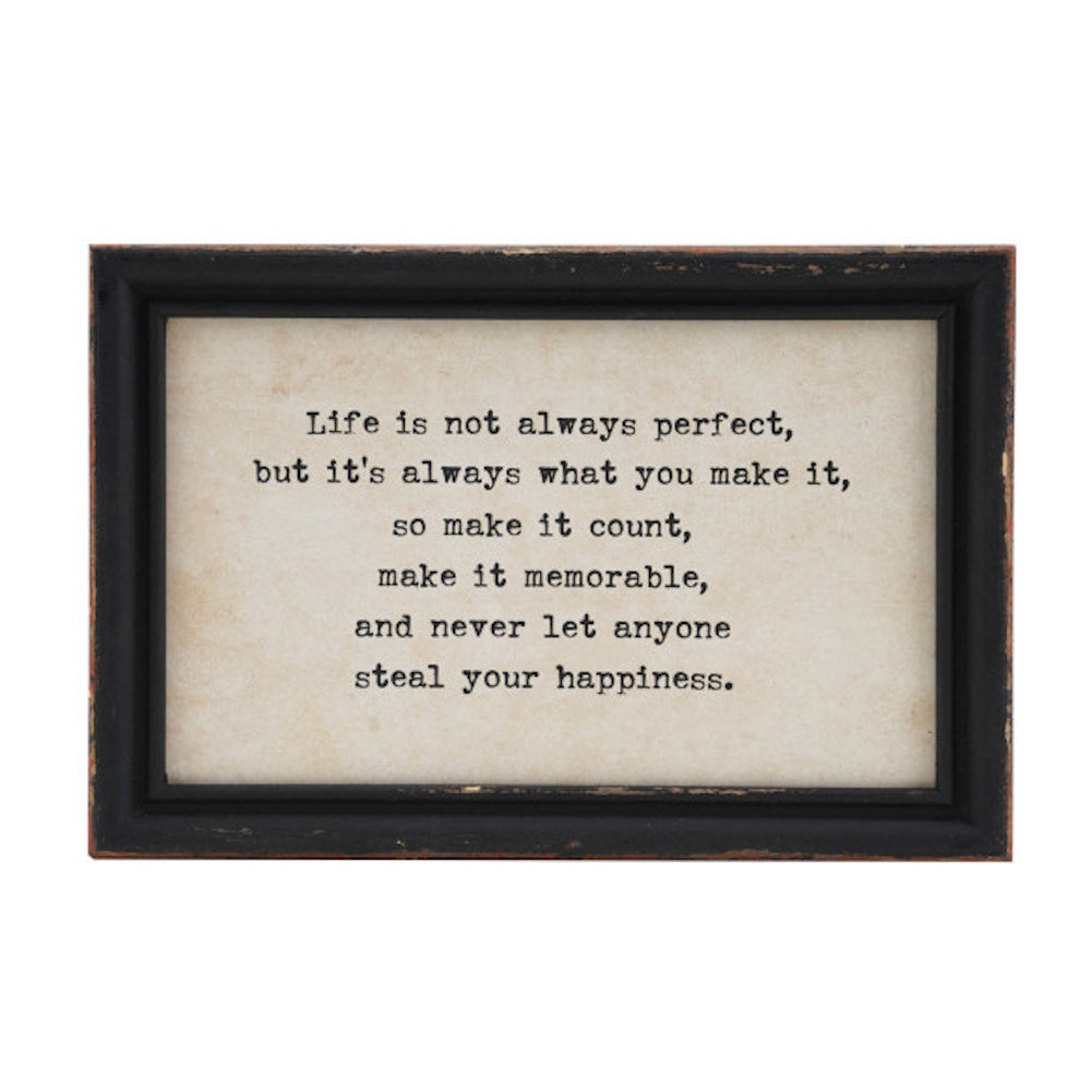 Distressed black wood frame with an inspirational quote printed on a textured, off-white background.