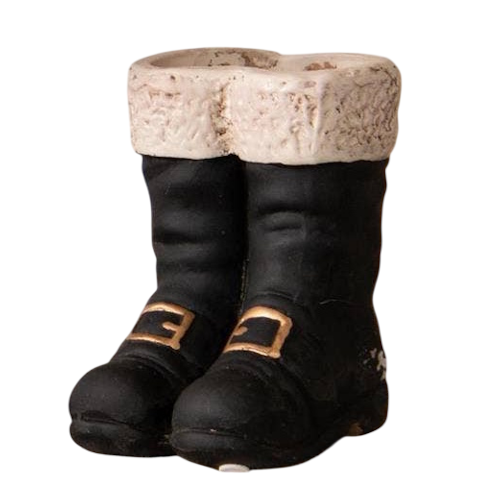 A pair of mini black Santa boot vases with white fuzzy trim and gold buckle details.