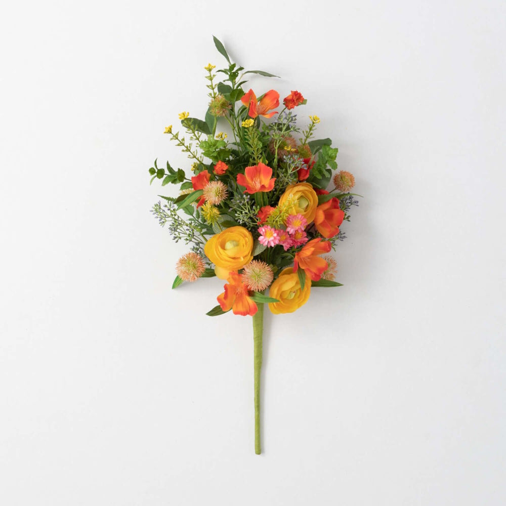 A vibrant bouquet of yellow, orange, and pink flowers with green stems against a white background.