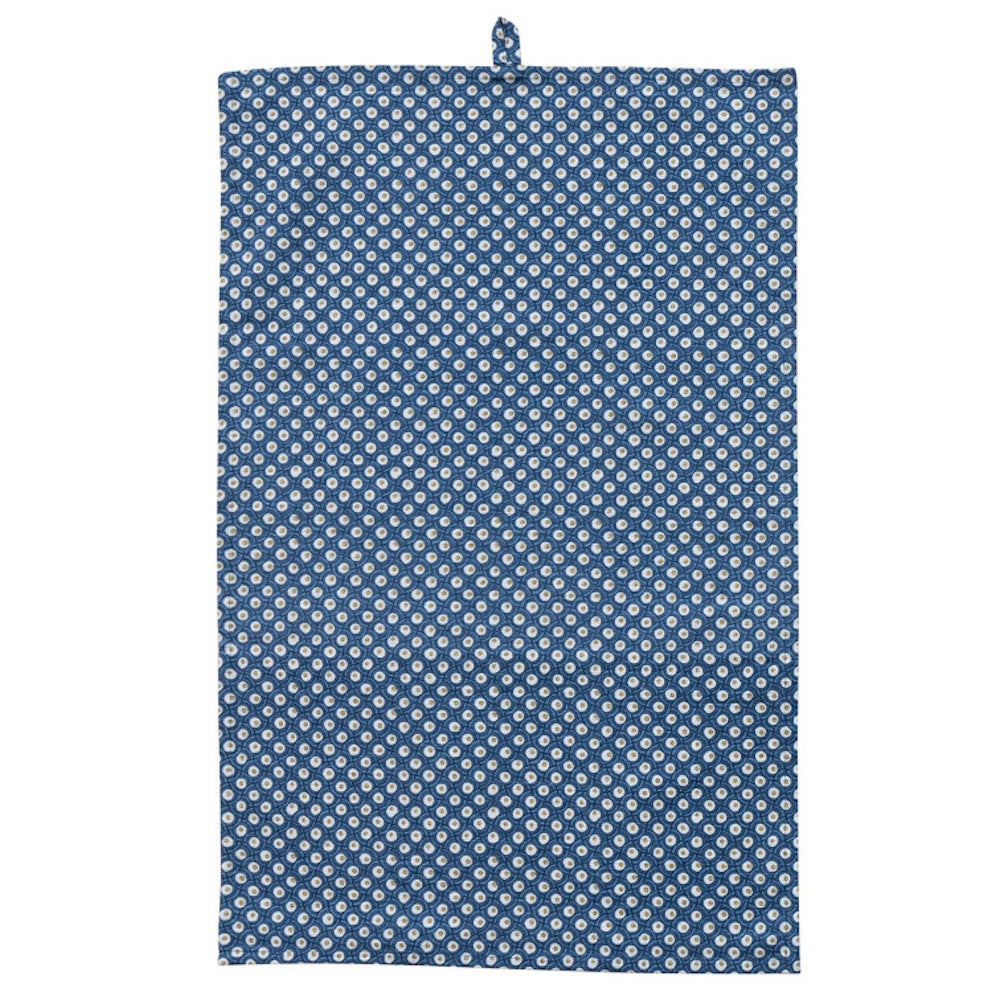 Blue cotton slub tea towel featuring a white geometric block print pattern and a small top loop for hanging.