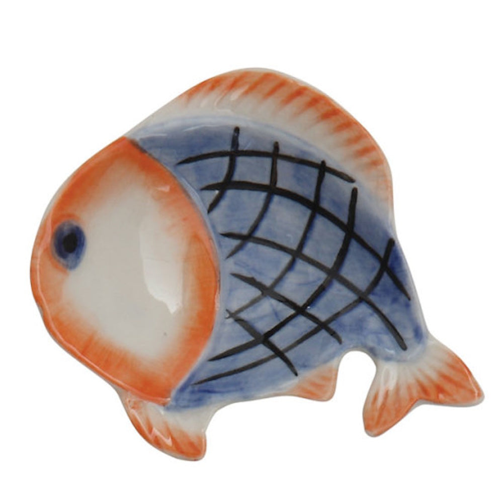 Hand-painted ceramic dish shaped like a fish, featuring a blue crosshatched body and bright orange fins.