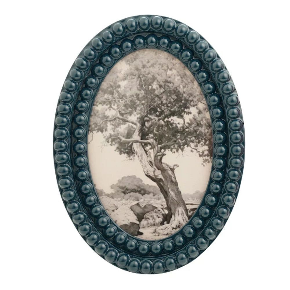 Oval teal resin bobbin photo frame featuring a black and white vintage sketch of a large, gnarled tree in a landscape.
