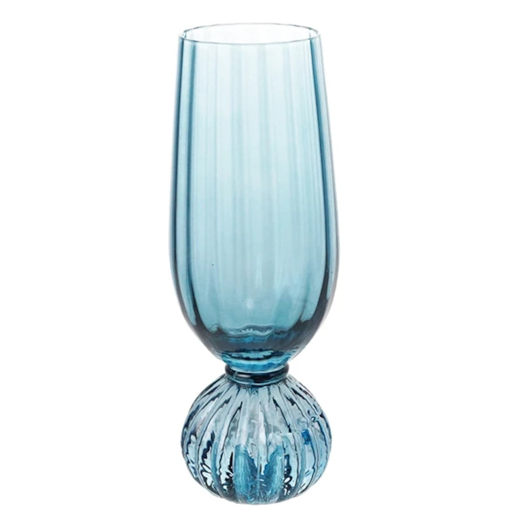 Blue pleated footed champagne glass with a ribbed texture and translucent finish on a white background.