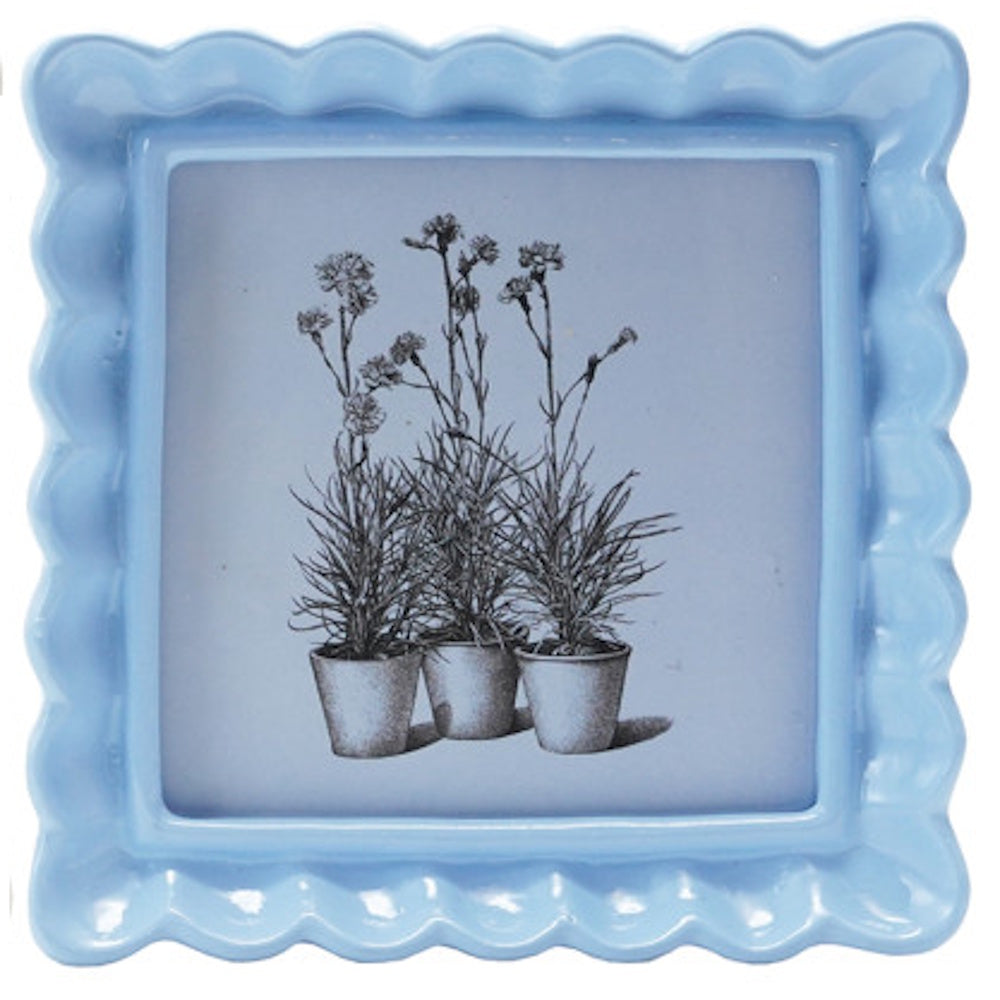 Light blue square photo frame with a wavy scalloped border, displaying a black and white botanical sketch.