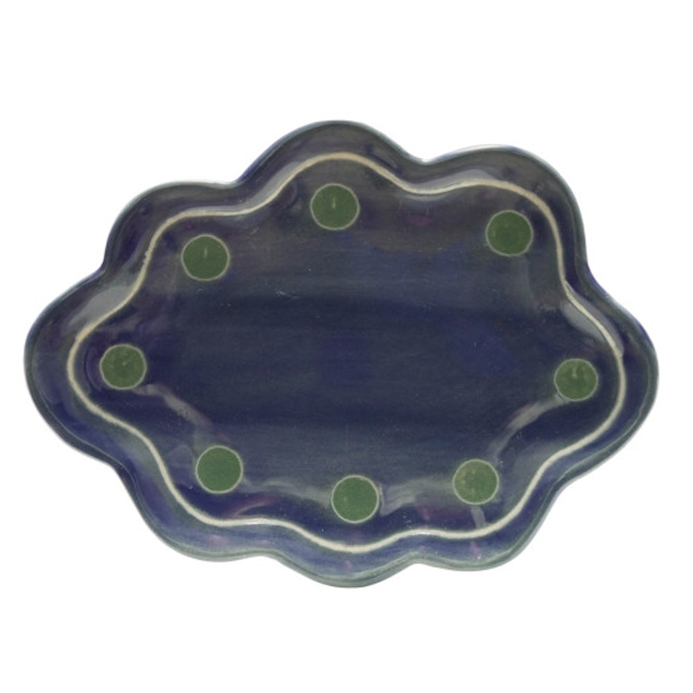Blue stoneware scalloped dish with a dark glazed finish and green polka dot accents along the border.