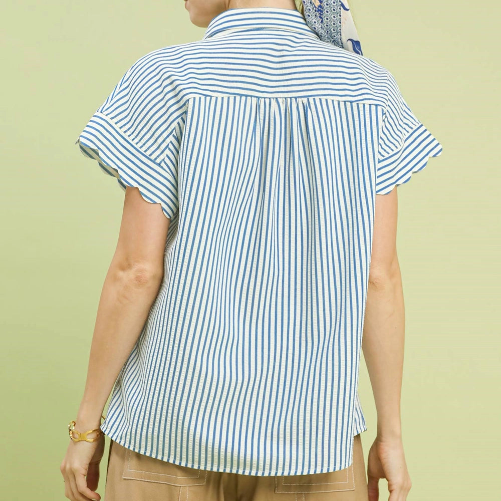 Back view of a blue and white striped button-down top featuring short scallop-edged sleeves and a collared neckline.