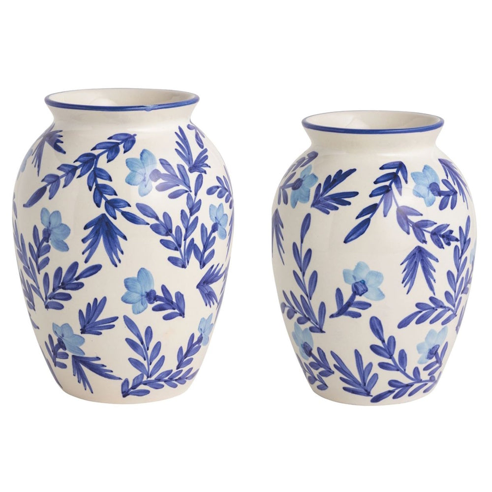 Two blue and white ceramic floral vases with hand-painted vine patterns on a plain white background.