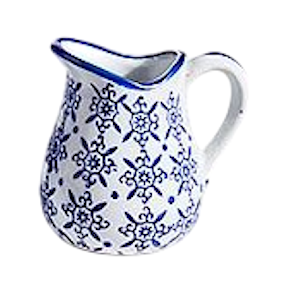 Small white ceramic pitcher with a blue mosaic medallion pattern on a white background.