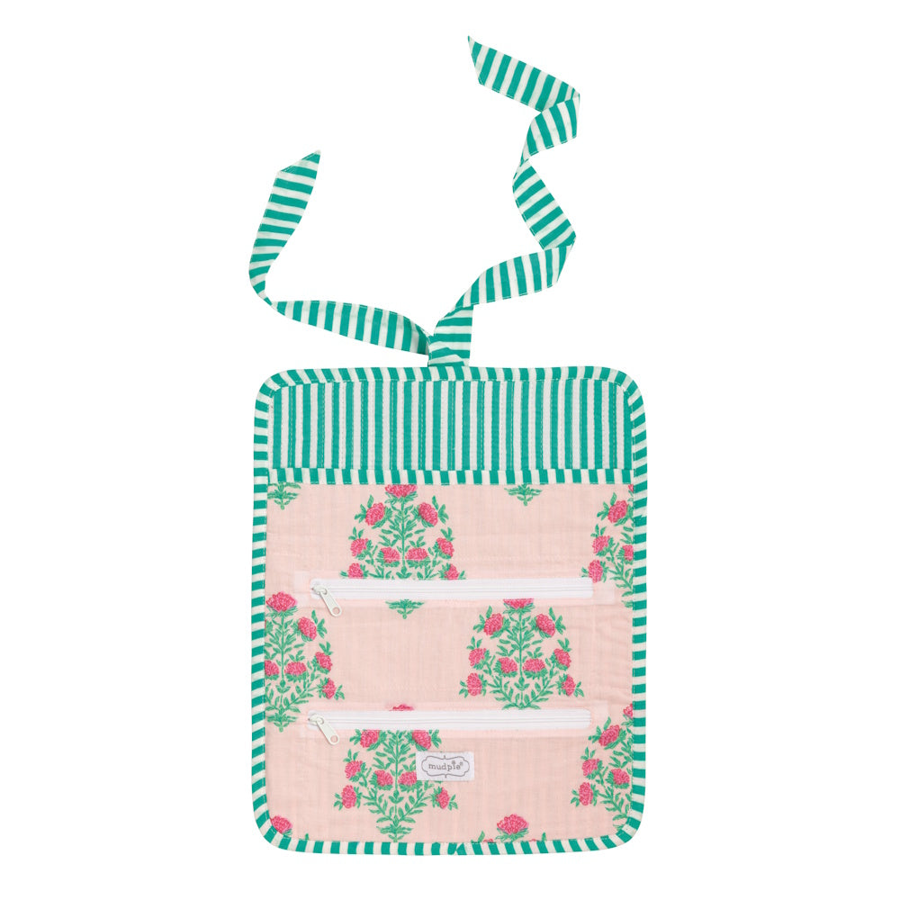 Pink and green floral block-print jewelry roll with striped trim, two zipper pockets, and a ribbon tie closure.