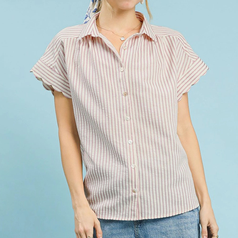 Blush and white striped button-down shirt with short scallop-edge sleeves and a pointed collar against a blue background.