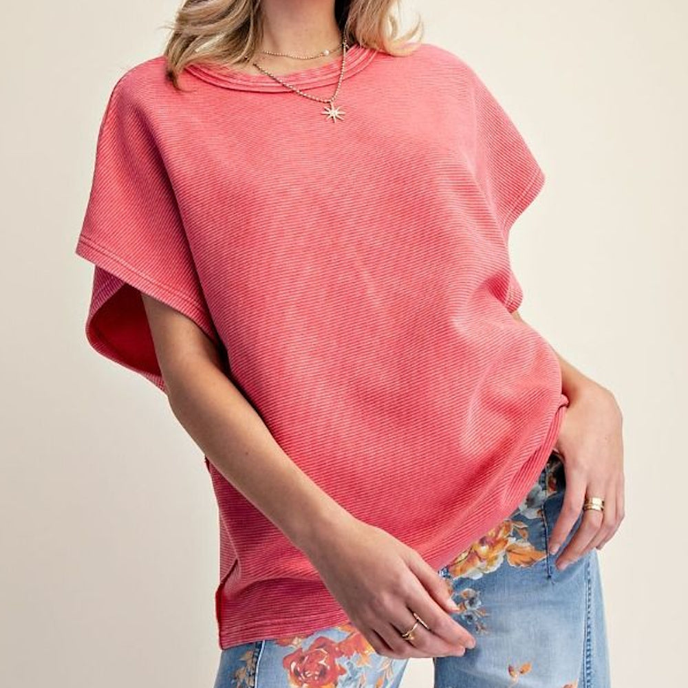 Red boho drop shoulder textured washed top with a relaxed fit and crew neck, paired with floral print denim jeans.
