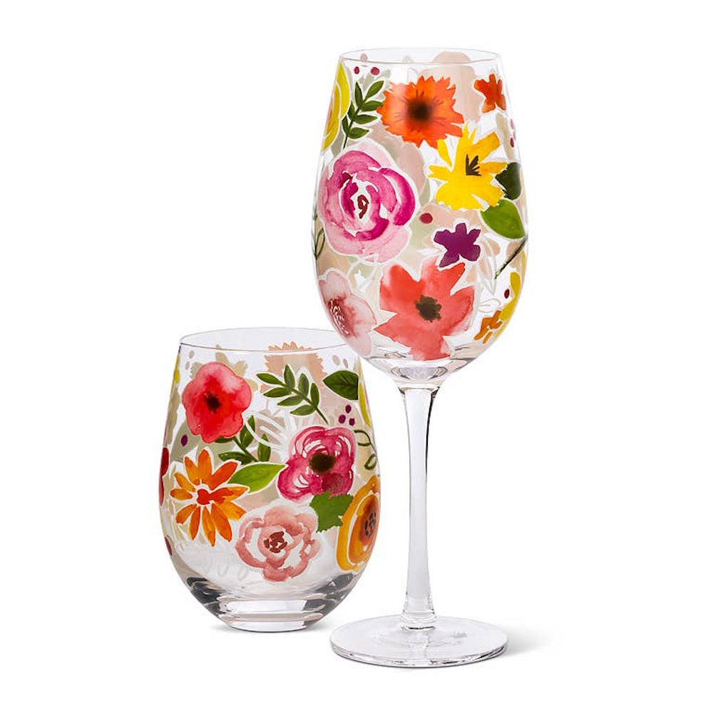 Hand-painted floral wine glass and stemless glass set with vibrant watercolor flowers on white background.
