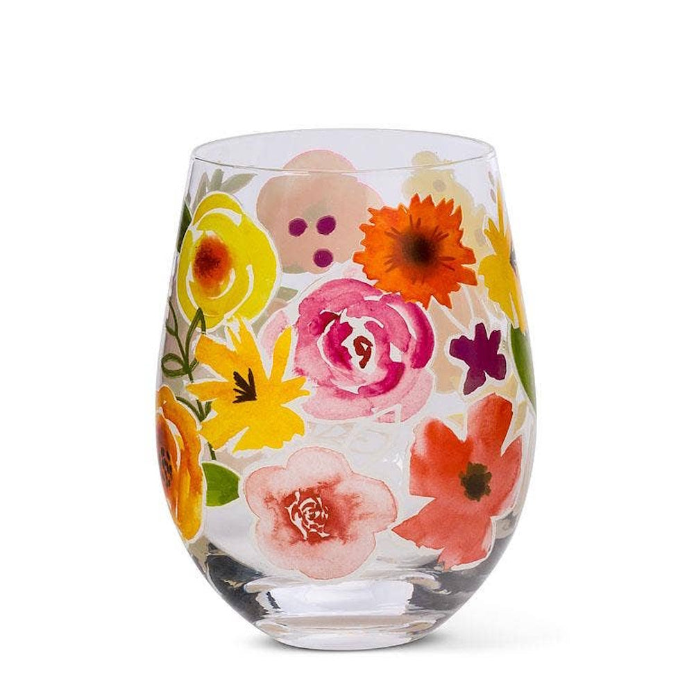 Stemless wine glass featuring a vibrant watercolor floral pattern with pink, yellow, and orange flowers.