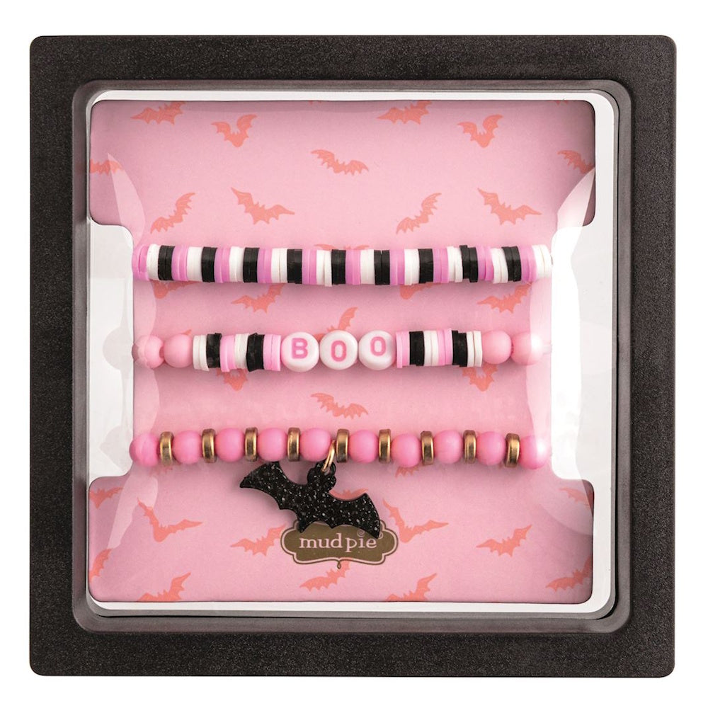 Mud Pie pink and black Halloween bracelet set with "BOO" text and bat charm in display box.