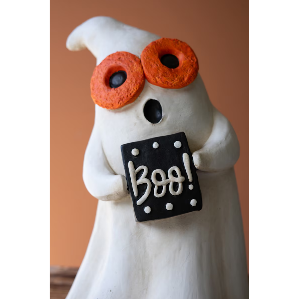 White ghost figurine holding a black Boo sign Halloween decoration.