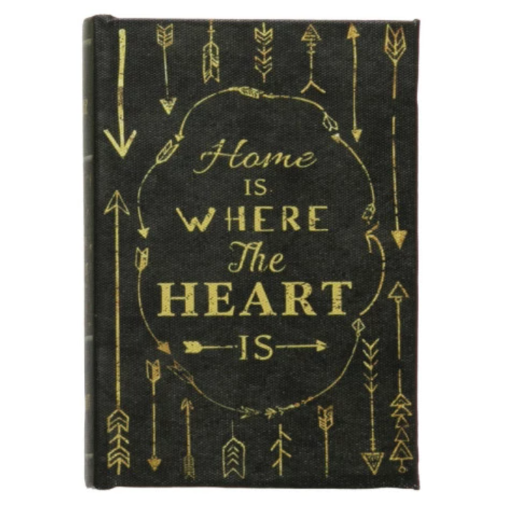 Home is Where the Heart is gold text on black book cover with tribal arrow patterns.