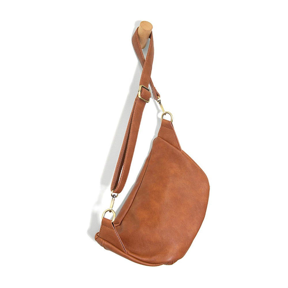 Cognac brown faux leather fanny pack and over-the-shoulder chest bag for travel and daily use.