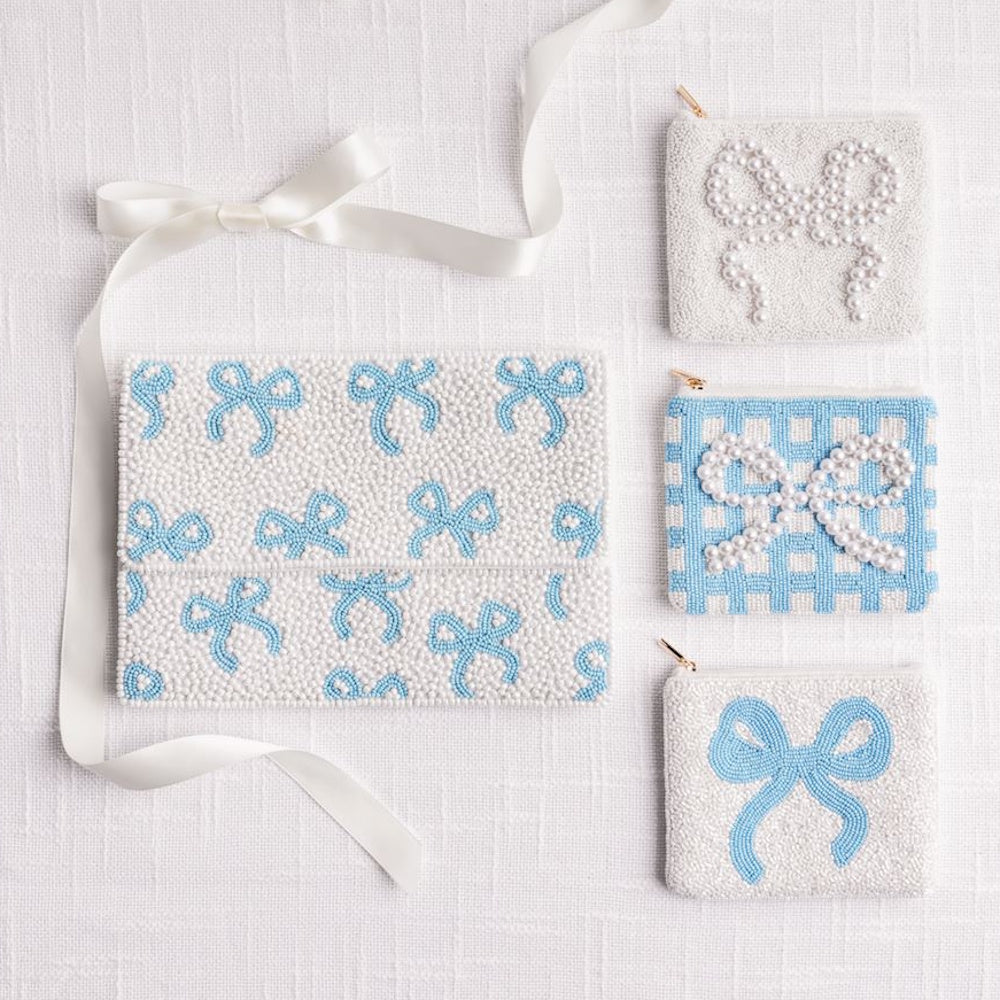Beaded bow coin purses and clutch in blue gingham, white, and pearl designs.