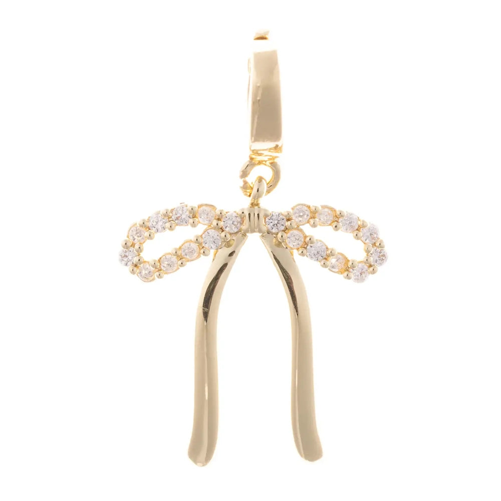 Gold bow pendant charm with pave crystal ribbon loops and polished gold tails on a white background.