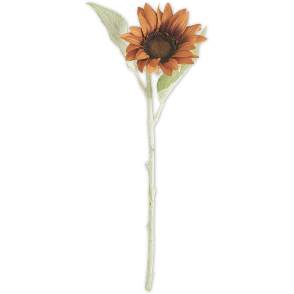 A single terracotta-colored faux sunflower stem with pale green leaves on a white background.