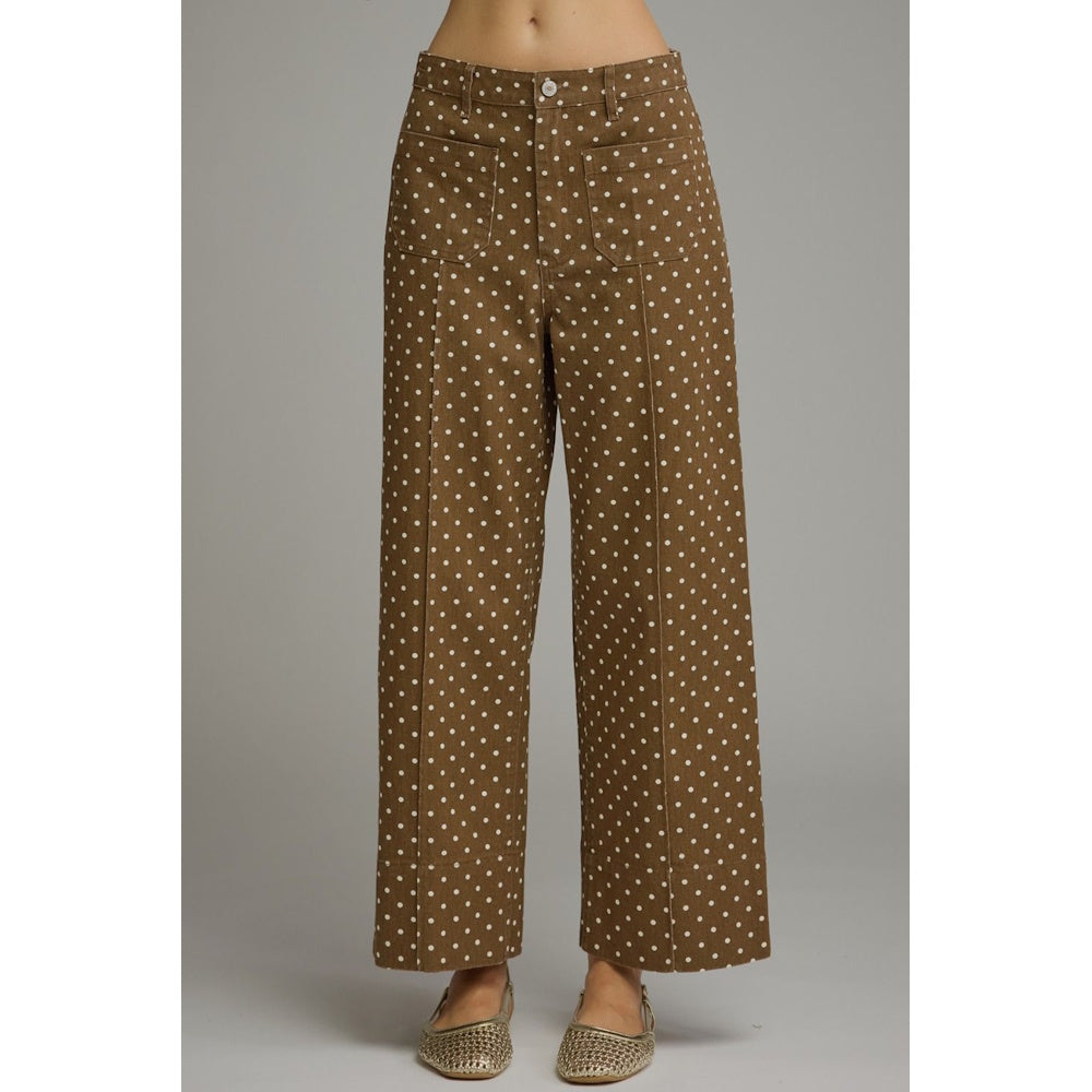 Brown wide-leg pants with white polka dots, front patch pockets, and center seams.
