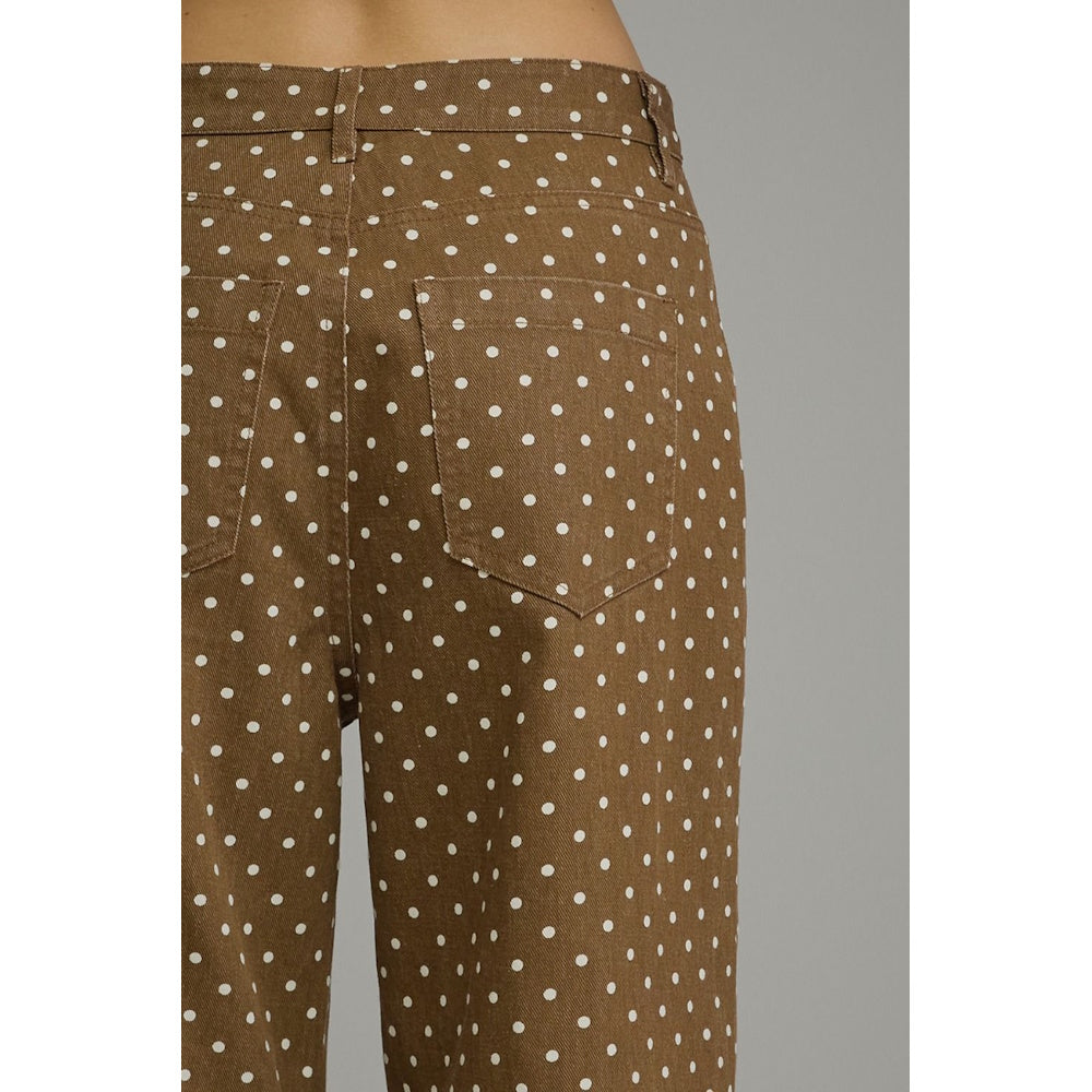 Close-up back view of brown polka-dot wide-leg pants detailing the waistband and rear patch pocket.