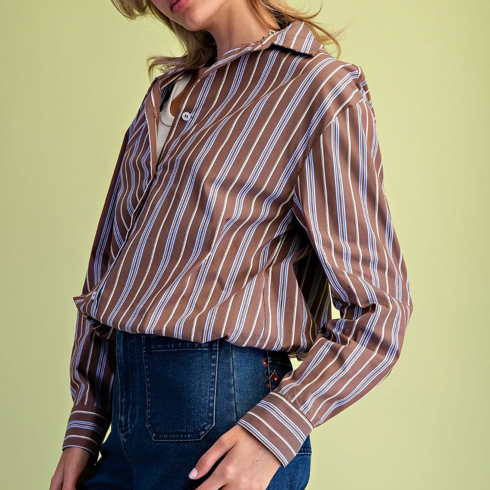 Side view of a brown button-down shirt with vertical white and blue stripes.