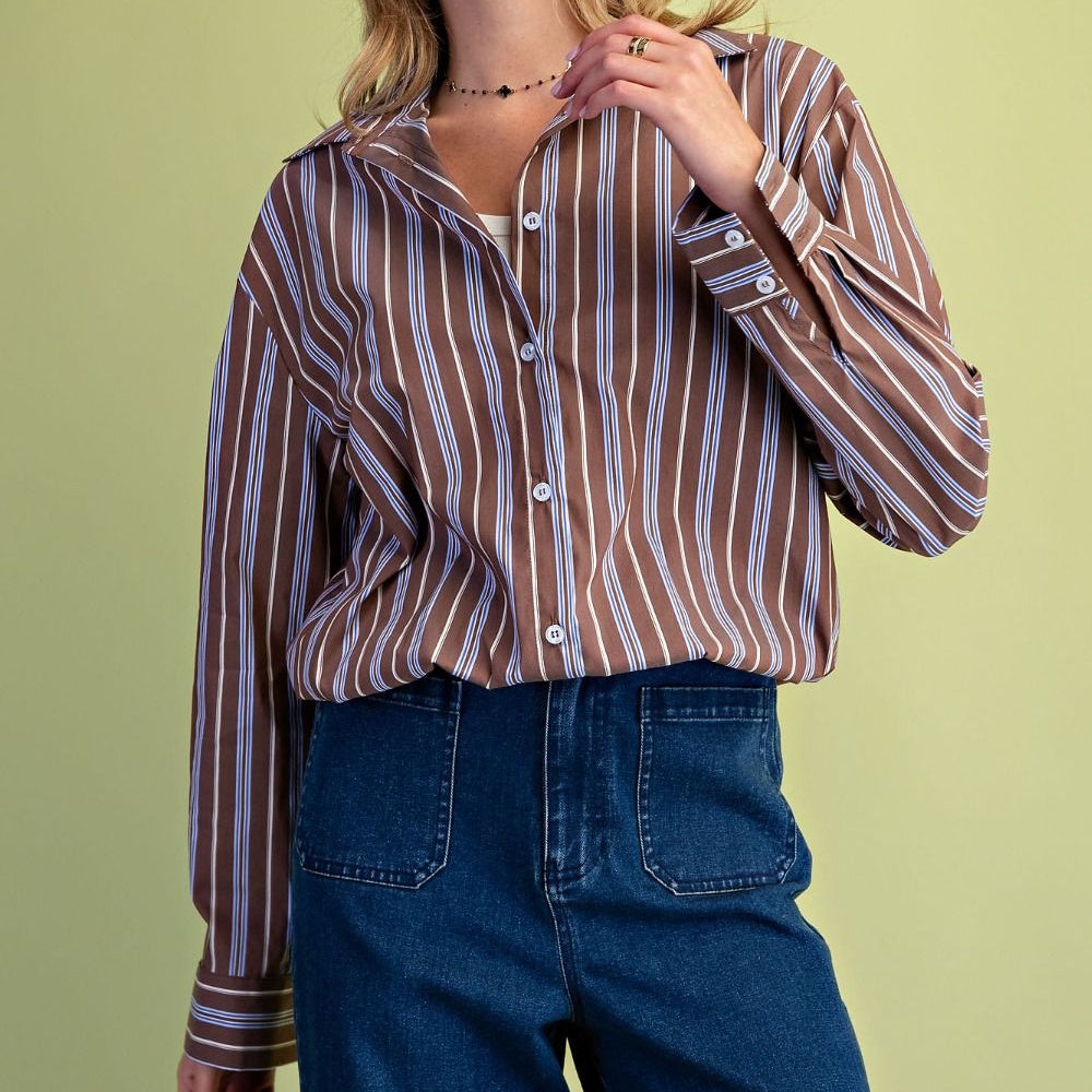 Front view of a brown button-down shirt with vertical white and blue stripes.