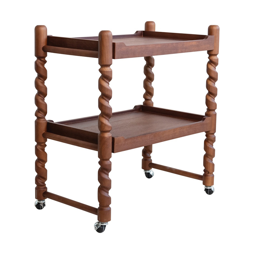 Two-tier brushed rubberwood bar cart with spiral twisted legs and rolling caster wheels on a white background.