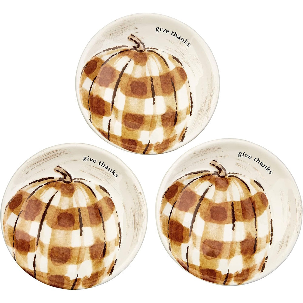 Three round white ceramic plates featuring a brown buffalo plaid pumpkin and the text "give thanks".