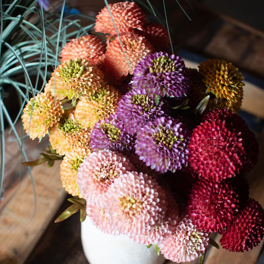 Artificial ball dahlia flower arrangement in pink, purple, and orange.