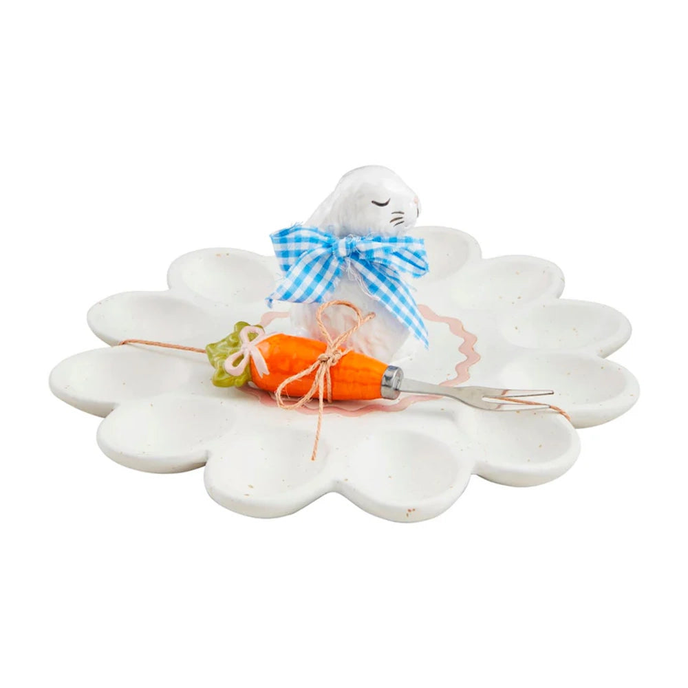 Ceramic bunny deviled egg platter with a carrot-handled serving fork.