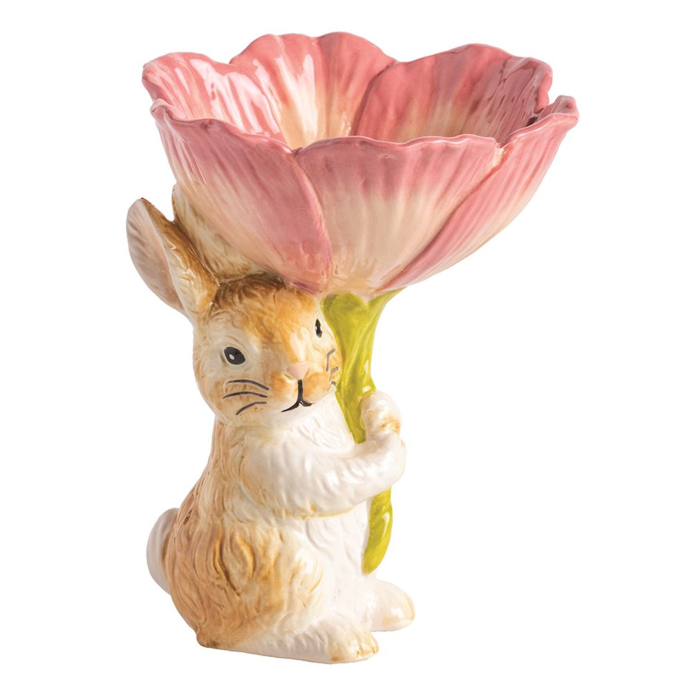Ceramic Easter bunny figurine holding a large pink tulip flower candy dish, spring home decor on a white background.